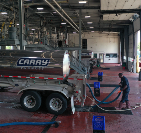 Man wearing boots cleaning truck